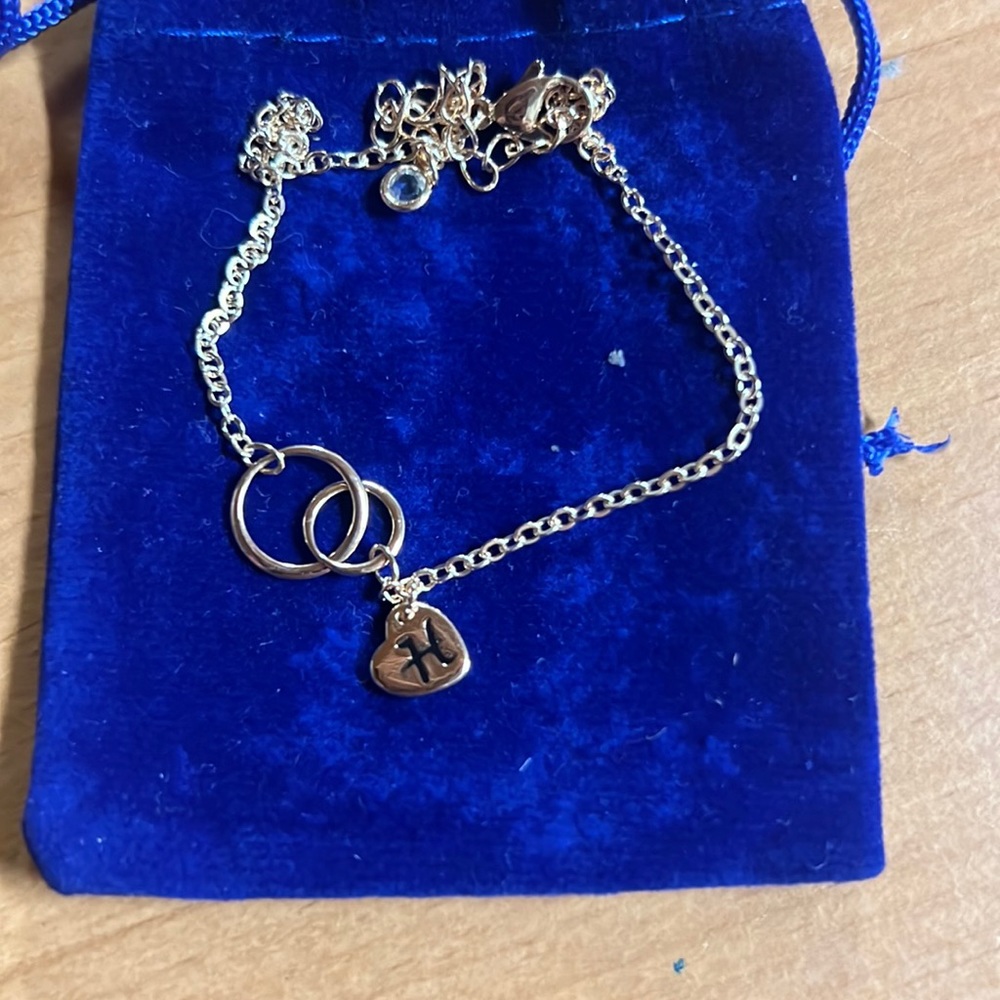Bracket or anklet letter “H”
